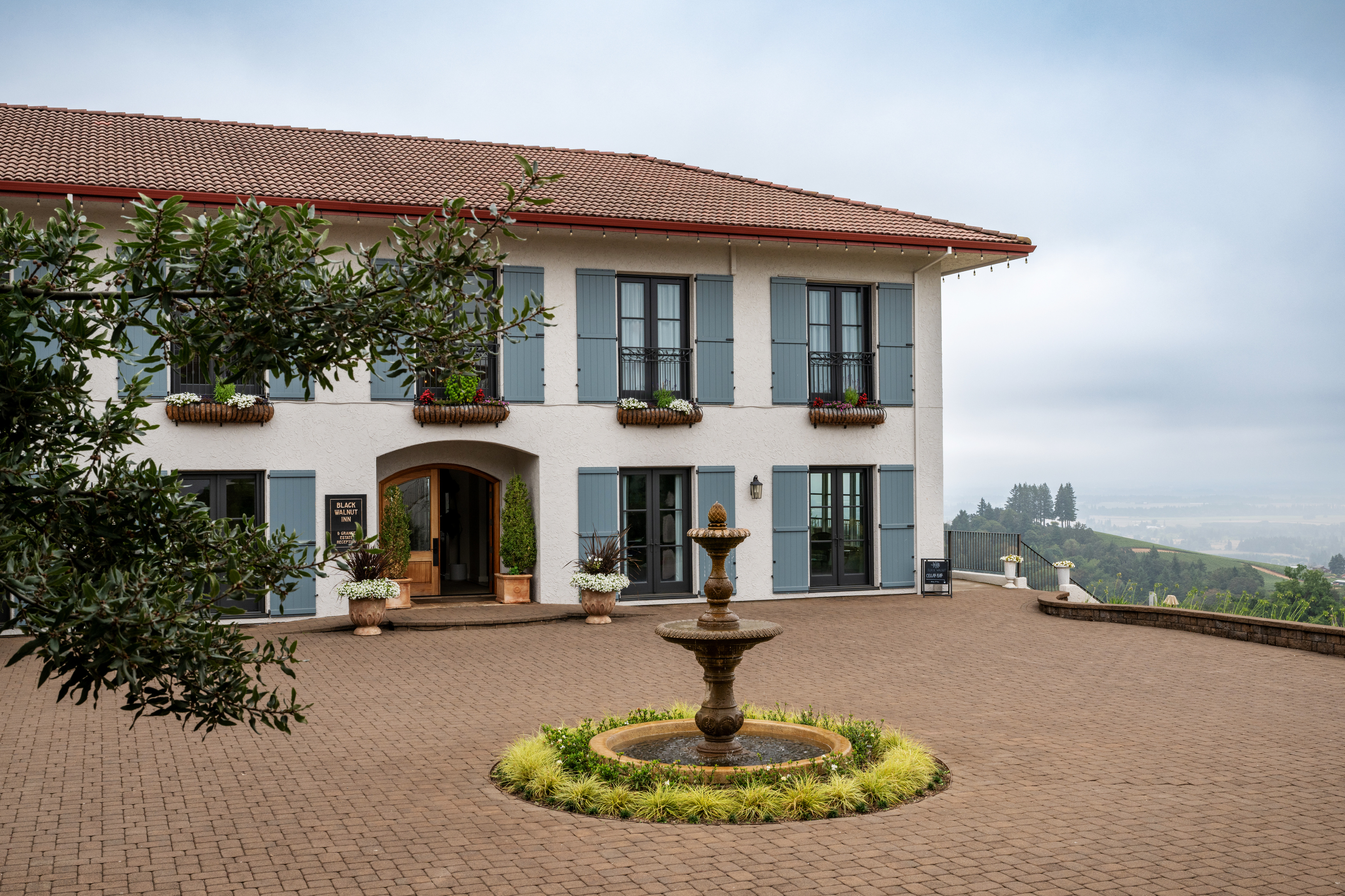 a white building with blue shutters